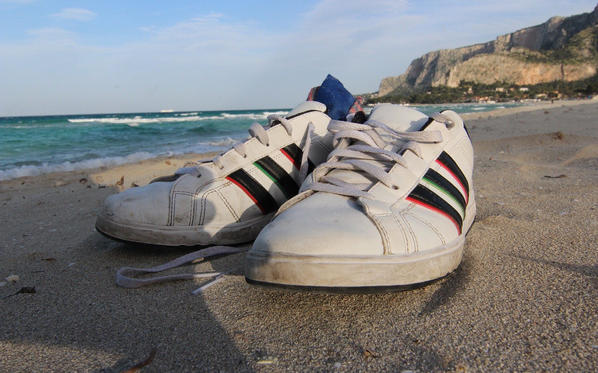 tennis shoes on beach